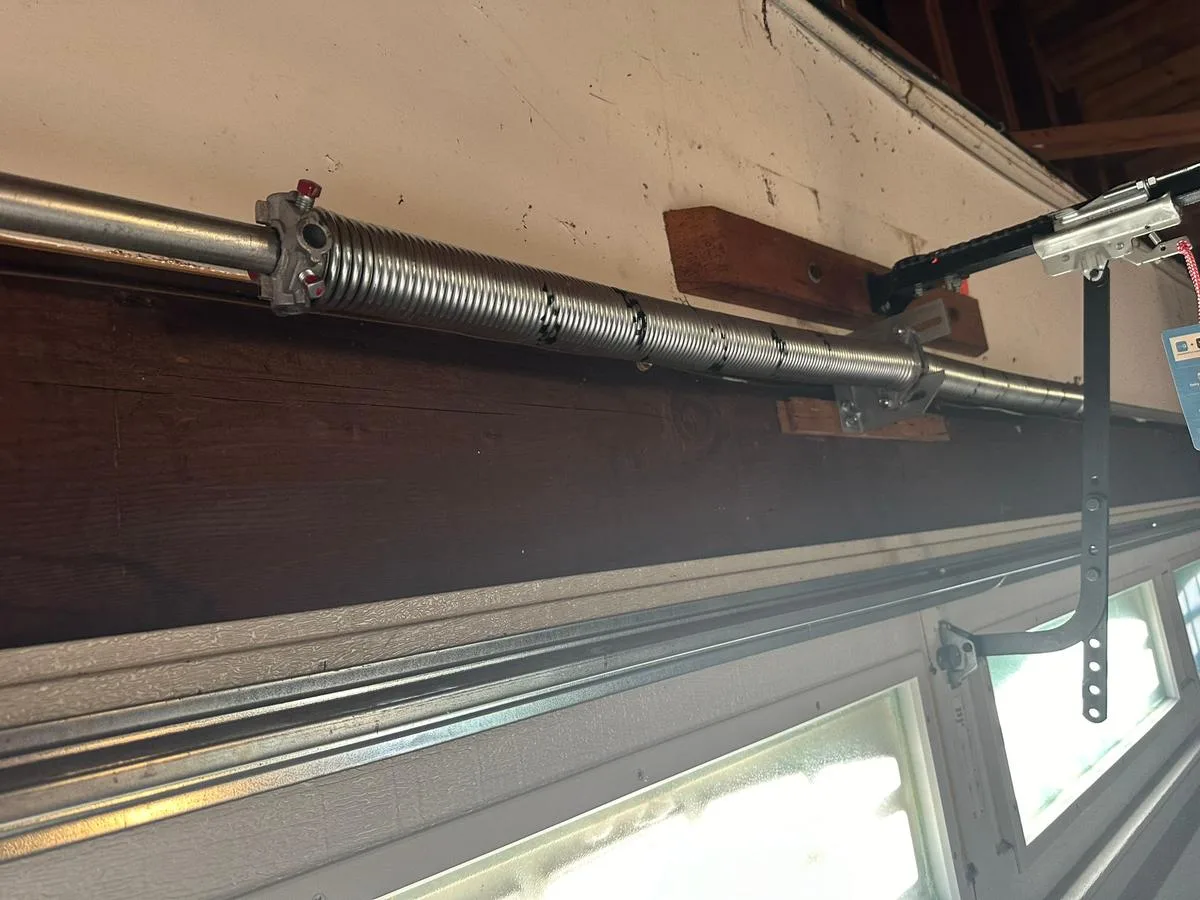 New torsion spring installed during garage door repair
